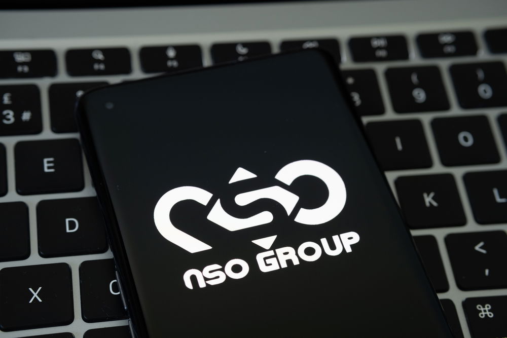 nso,group,logo,seen,on,the,smartphone,placed,on,laptop